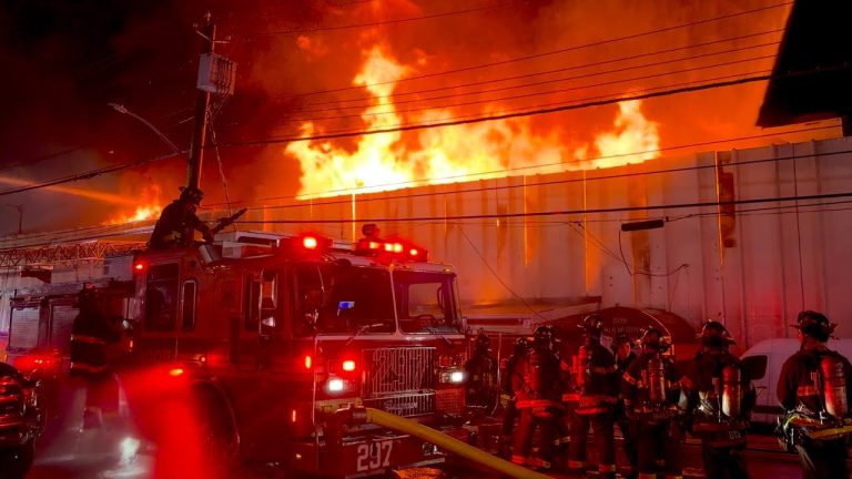 FDNY battles five-alarm lumberyard blaze with high volume fire conditions